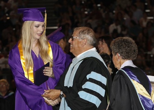 Dr. Lupe Solis greets a recent Lemoore grad.